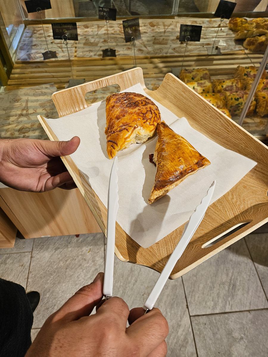 triangle pastry with tongs